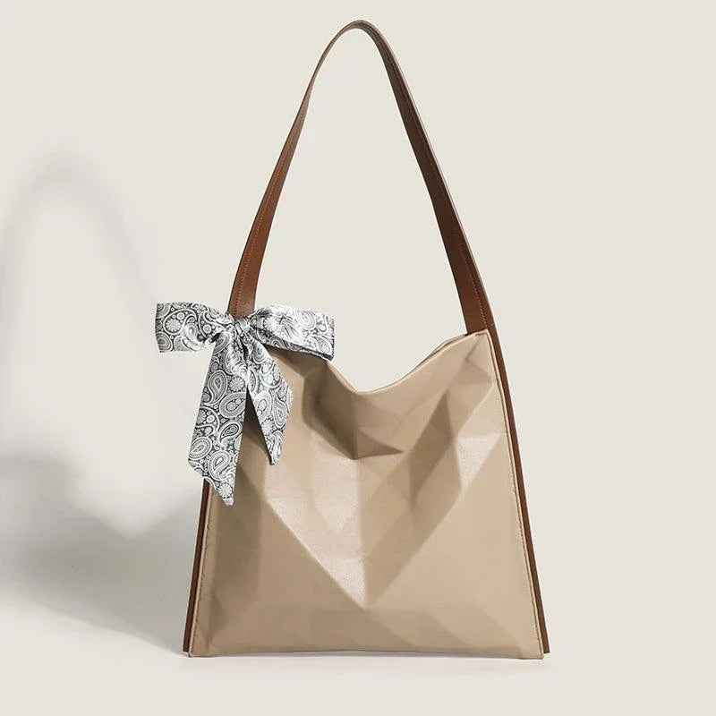 Stylish large-capacity tote bag with a geometric design, made from durable PU leather and featuring a spacious interior and convenient magnetic closure.