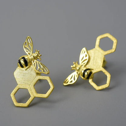 Handcrafted sterling silver beehive ear studs with a unique design inspired by nature's hard workers