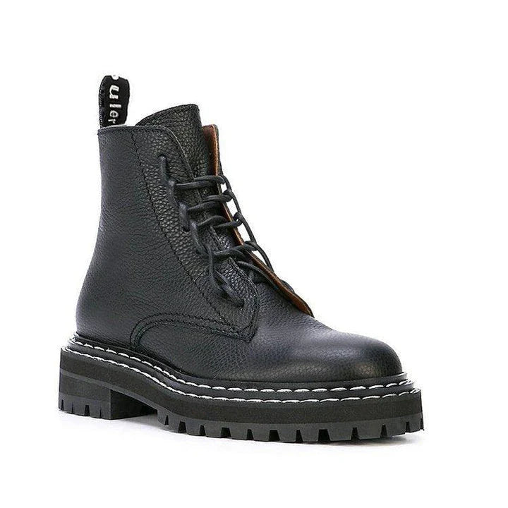 Stylish women's platform locomotive boots with leather upper and rubber sole, in black and cotton black colors
