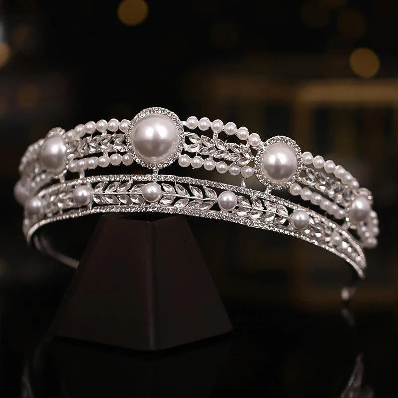 Elegant pearl crown and veil set with intricate silver or gold plated alloy design and sparkling crystal accents, perfect for a fairytale wedding day