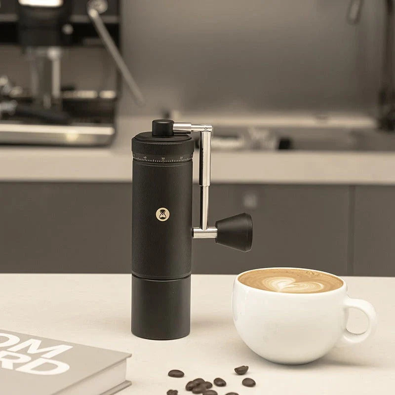 Premium manual coffee grinder with sleek design, stainless steel burrs, and external grind adjustment for customizable brewing