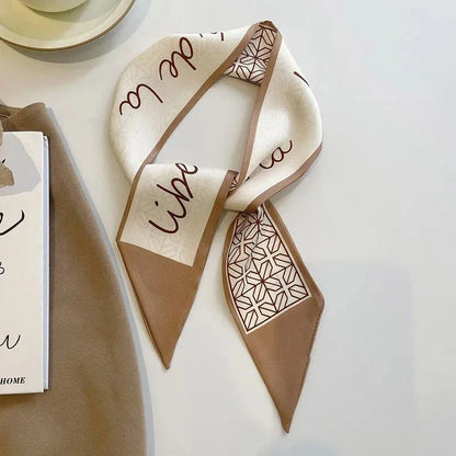 A high-quality silk scarf hair band in a versatile khaki nude color, perfect for adding elegance to any Kiwi outfit.