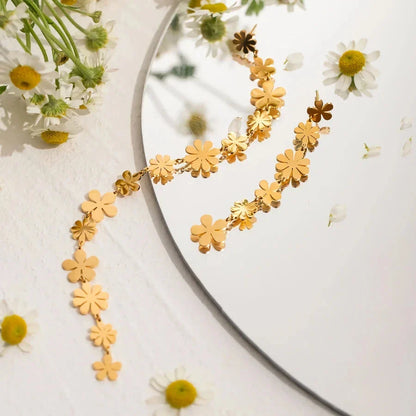 Elegant asymmetrical daisy earrings in 18K gold plating, designed for the modern Kiwi woman