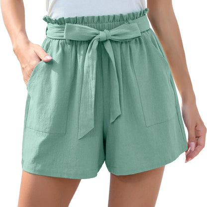 Stylish high-waisted ruffle bow shorts in black, perfect for Kiwi summer beach and casual wear