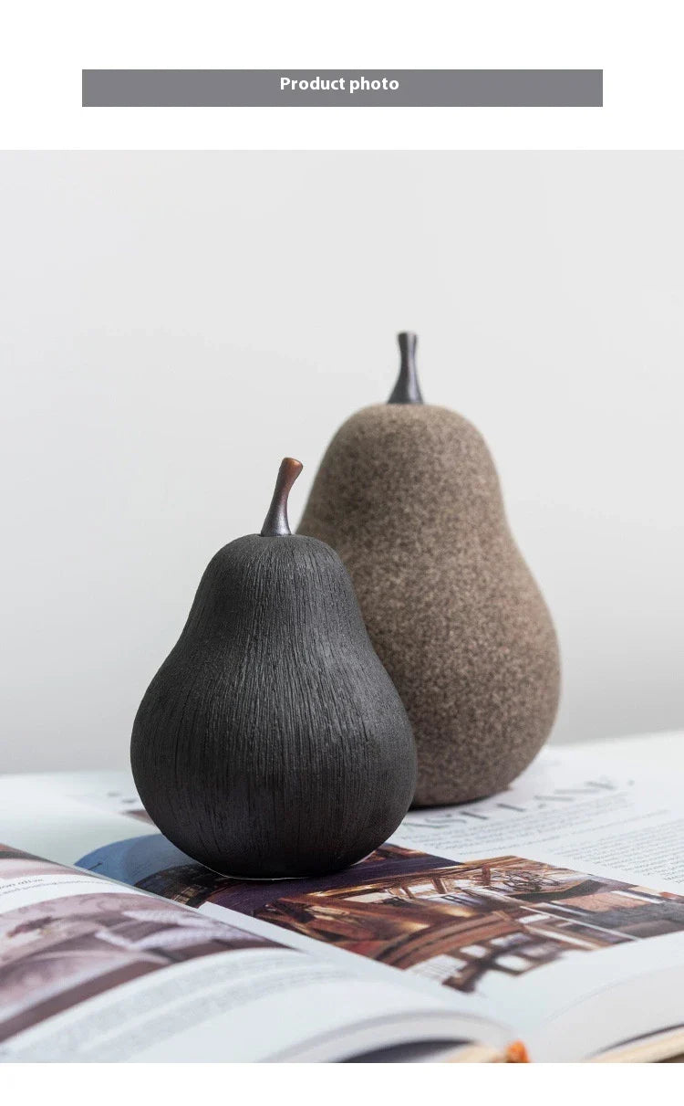 Handcrafted ceramic pear decoration with a sleek, modern design, perfect for adding a touch of natural elegance to any Kiwi home