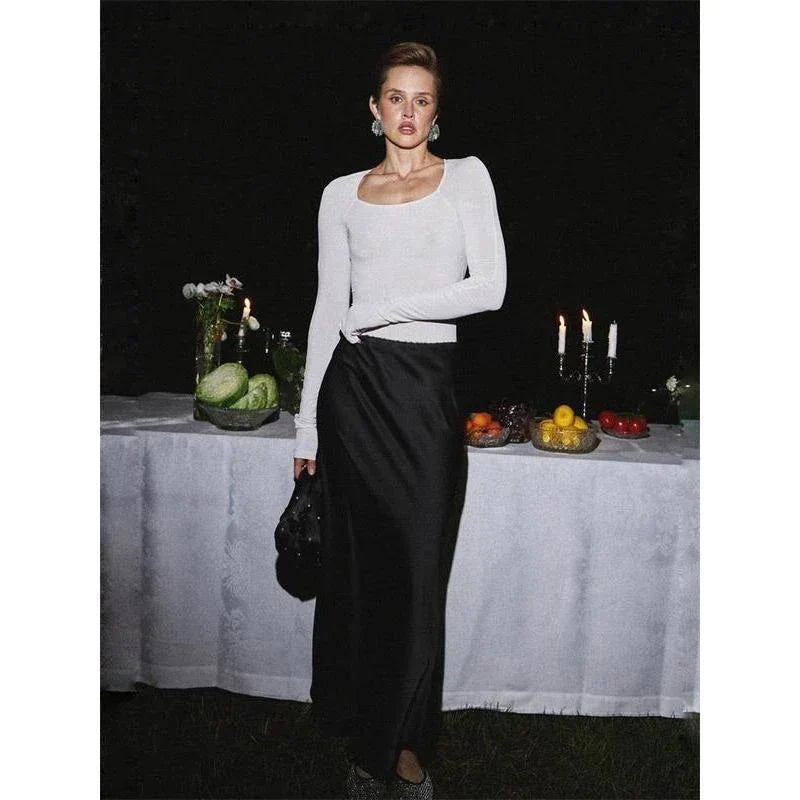 Elegant high-waisted satin maxi skirt in black, a timeless and sophisticated wardrobe essential for the modern Kiwi woman.