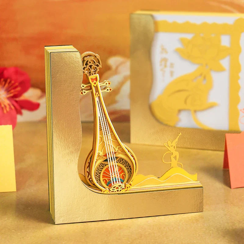 A three-dimensional paper carving notepad with a stunning Dunhuang Pipa design, a captivating desk accessory for the modern Kiwi office.