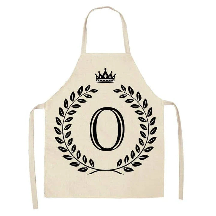 A crown and letter printed kitchen apron made of high-quality cotton and linen, suitable for both men and women in New Zealand kitchens.