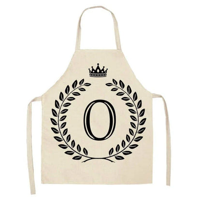 A crown and letter printed kitchen apron made of high-quality cotton and linen, suitable for both men and women in New Zealand kitchens.