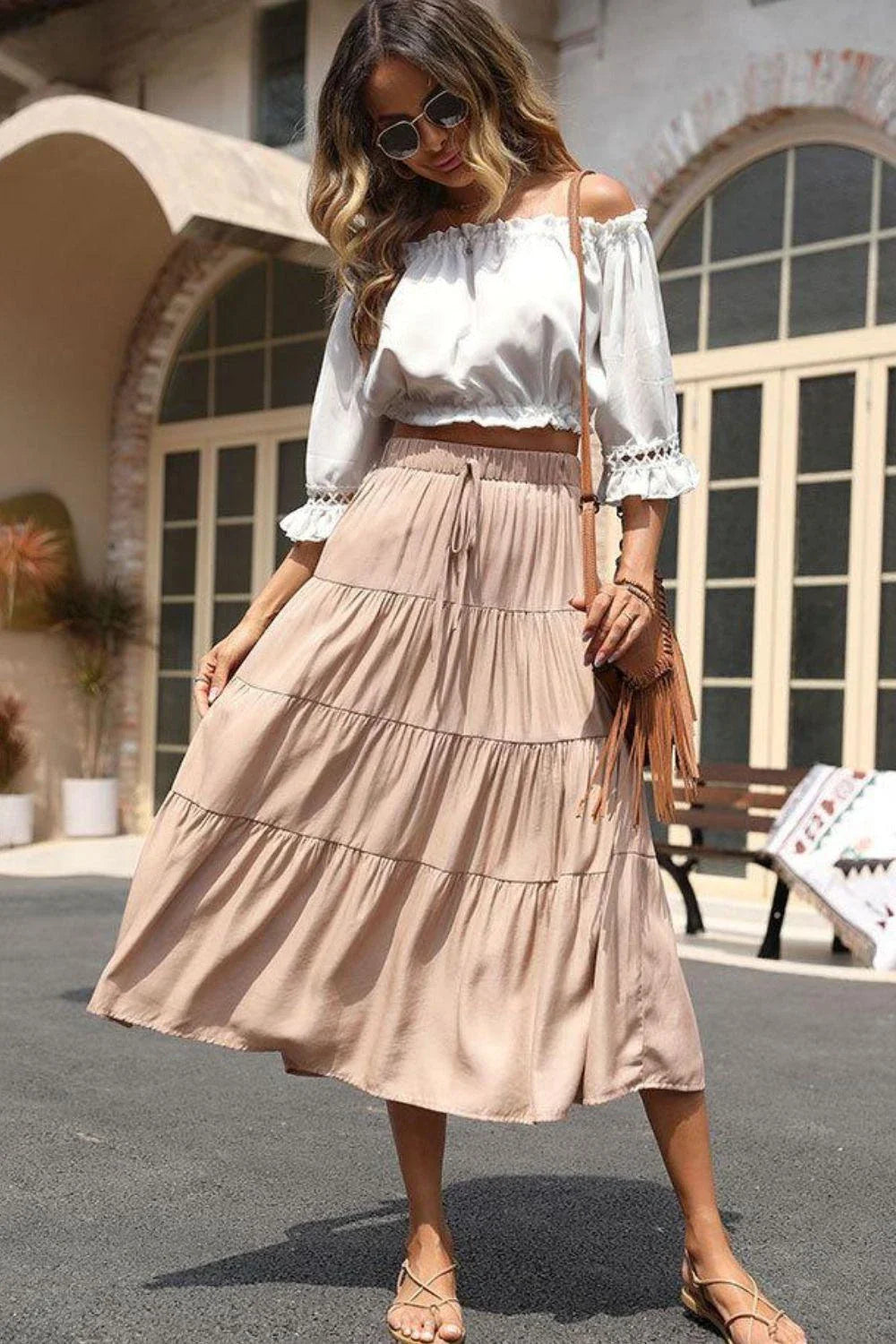 Stylish tiered midi skirt in khaki color with comfortable elastic waistband, made from premium polyester fabric