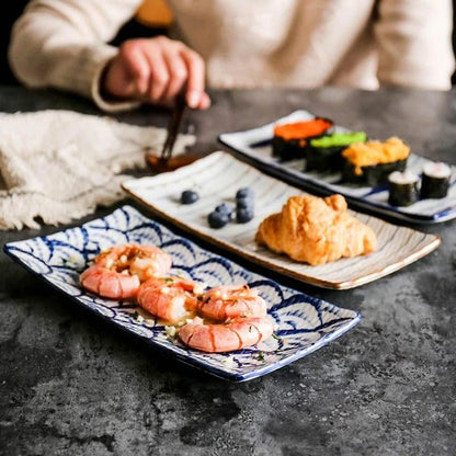 Beautifully crafted Japanese-inspired ceramic plate with a blue and orange glazed finish, perfect for Kiwi homes