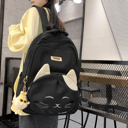 A stylish Japanese-inspired cat backpack with a large capacity, breathable nylon construction, and dedicated storage compartments for student essentials.