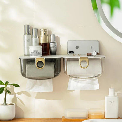 A modern, grey wall-mounted tissue dispenser with a sleek, stylish design to keep tissues and face towels organised in the bathroom or kitchen.