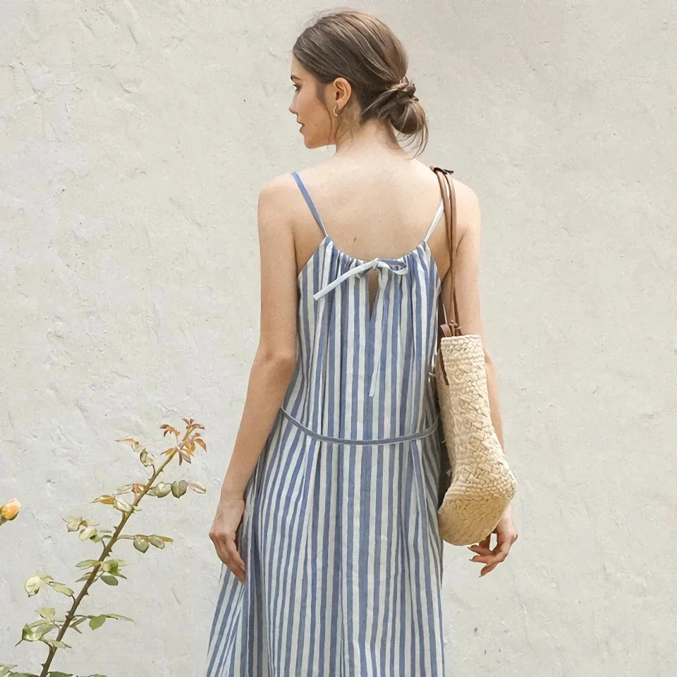 A stylish striped cotton linen maxi dress with an elegant A-line silhouette, perfect for summer in New Zealand.