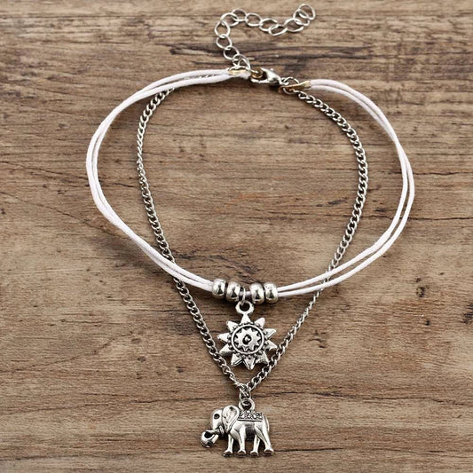 Bohemian-style anklet with star and elephant pendant charms, made from durable zinc alloy in shimmering silver and gold tones