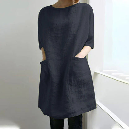 A cotton and linen dress with a round neckline, pockets, and an A-line silhouette in various colors.