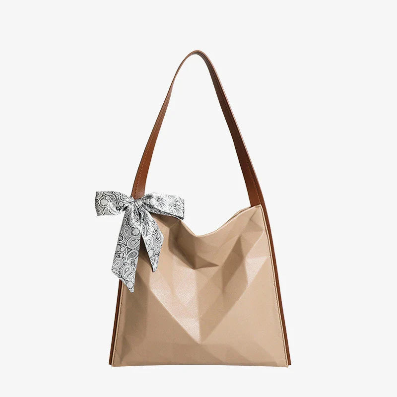 Stylish large-capacity tote bag with a geometric design, made from durable PU leather and featuring a spacious interior and convenient magnetic closure.