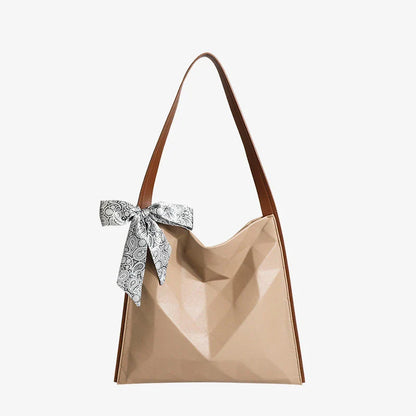 Stylish large-capacity tote bag with a geometric design, made from durable PU leather and featuring a spacious interior and convenient magnetic closure.