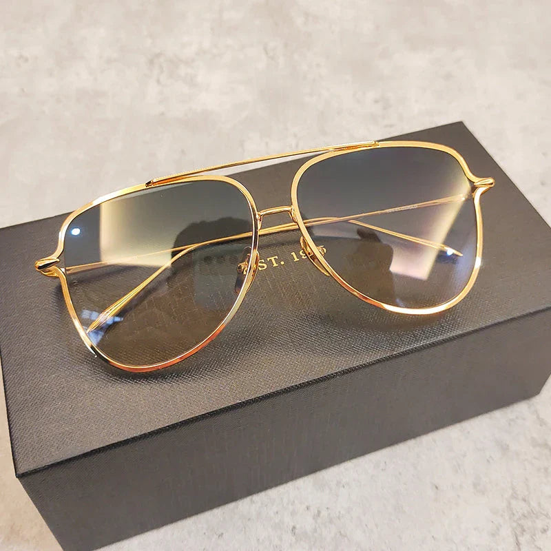 Premium pure titanium pilot sunglasses with a luxurious gold finish, offering superior UV protection and timeless vintage-inspired design.