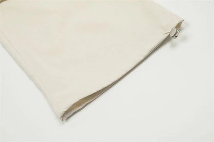 Stylish black overalls with pleated pockets, designed for the active Kiwi lifestyle