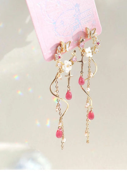 Elegant sterling silver and gold-plated earrings adorned with iridescent freshwater pearls