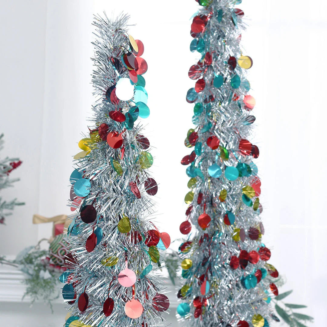 A collapsible and decorative Christmas tree in festive colors, designed for small spaces in New Zealand homes.