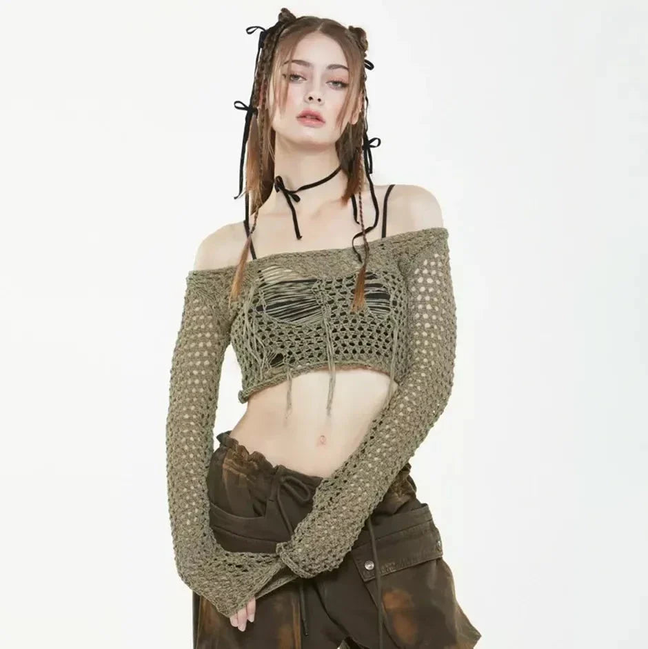 A stylish knitted sweater with hollow-out detailing and tassels, perfect for Kiwi autumn fashion