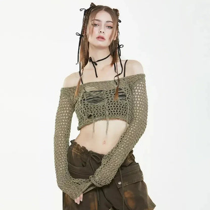 A stylish knitted sweater with hollow-out detailing and tassels, perfect for Kiwi autumn fashion