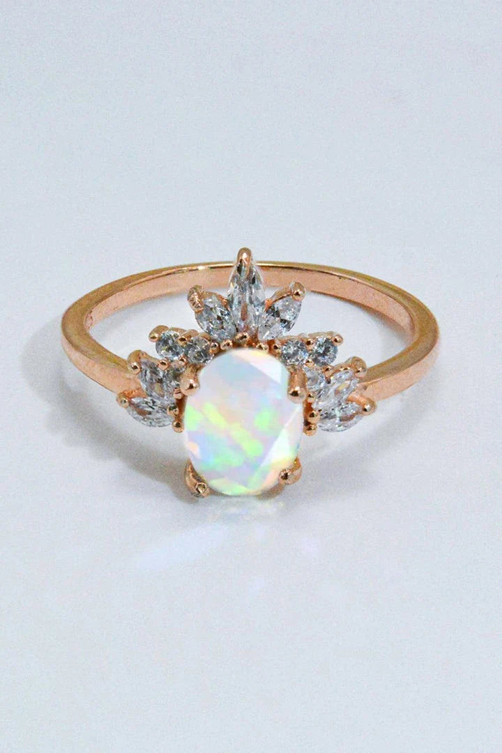 A close-up view of a 925 sterling silver ring featuring a shimmering opal stone, showcasing the modern and sustainable design.