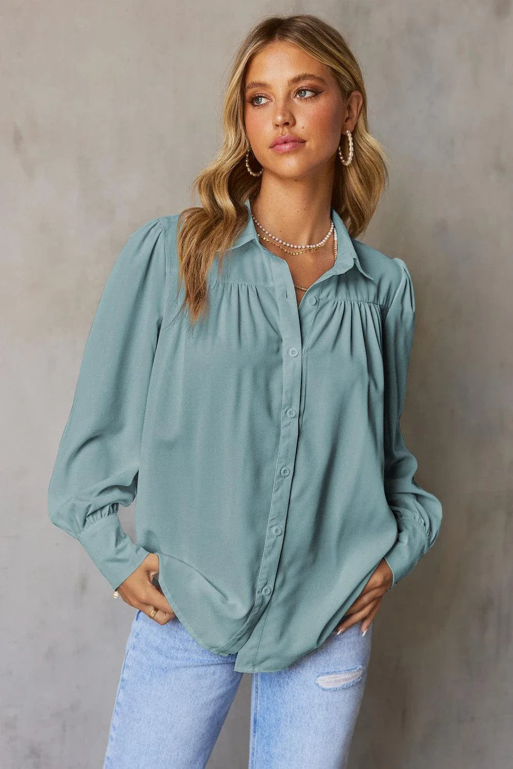 Gathered Detail Puff Sleeve Shirt in blue, featuring a collared neckline, buttoned front, and distinct puff sleeves for a timeless Kiwi style.