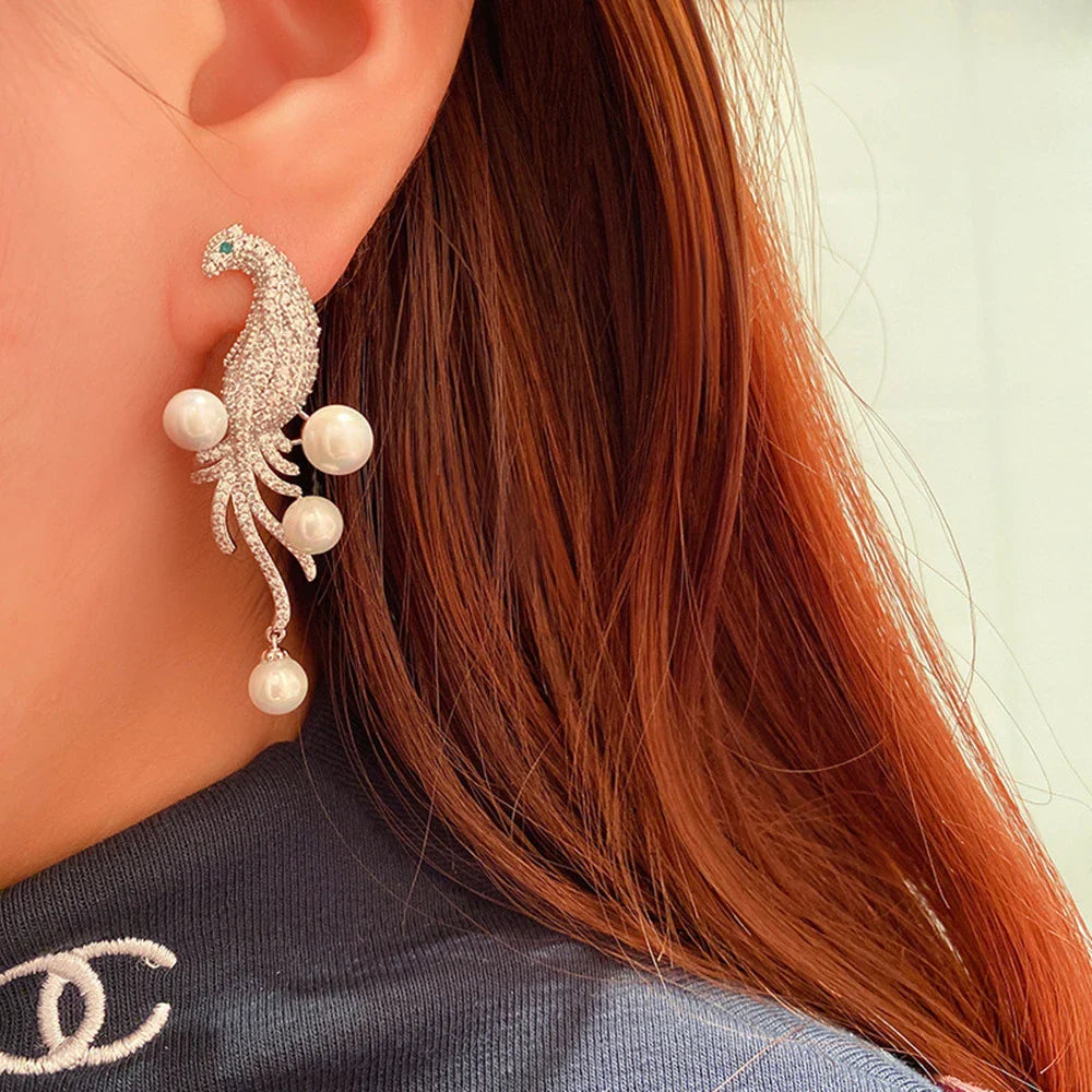 Elegant bird-themed pearl and tassel stud earrings in a versatile design