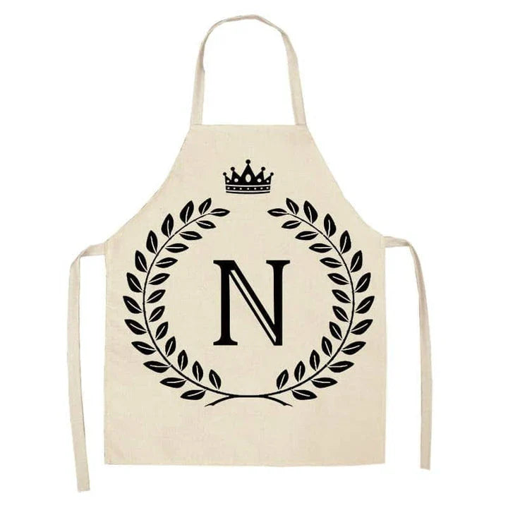 A crown and letter printed kitchen apron made of high-quality cotton and linen, suitable for both men and women in New Zealand kitchens.