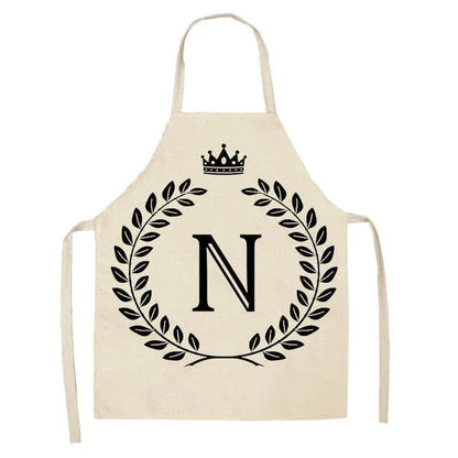 A crown and letter printed kitchen apron made of high-quality cotton and linen, suitable for both men and women in New Zealand kitchens.