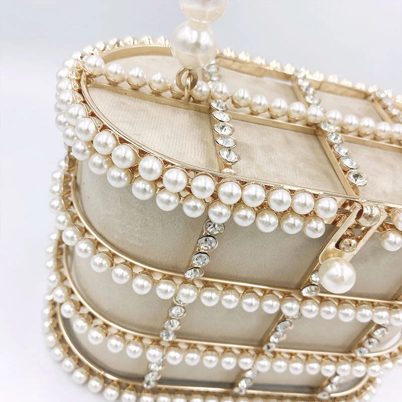 Stylish Kiwi-designed messenger bag with pearl embellishments and roomy interior for summer adventures