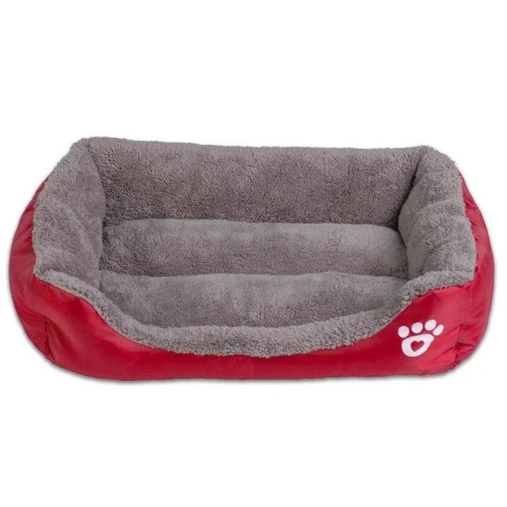 A cozy, waterproof pet bed featuring a soft fleece lining and paw print design, perfect for providing comfort and support for your beloved companion.