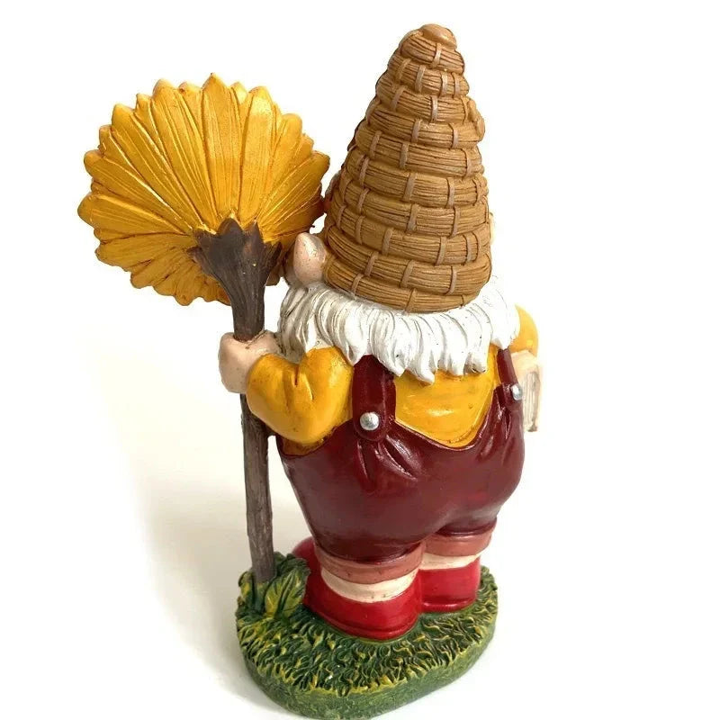 A charming resin garden gnome statue holding a sunflower and book, designed to brighten up any Kiwi outdoor space.