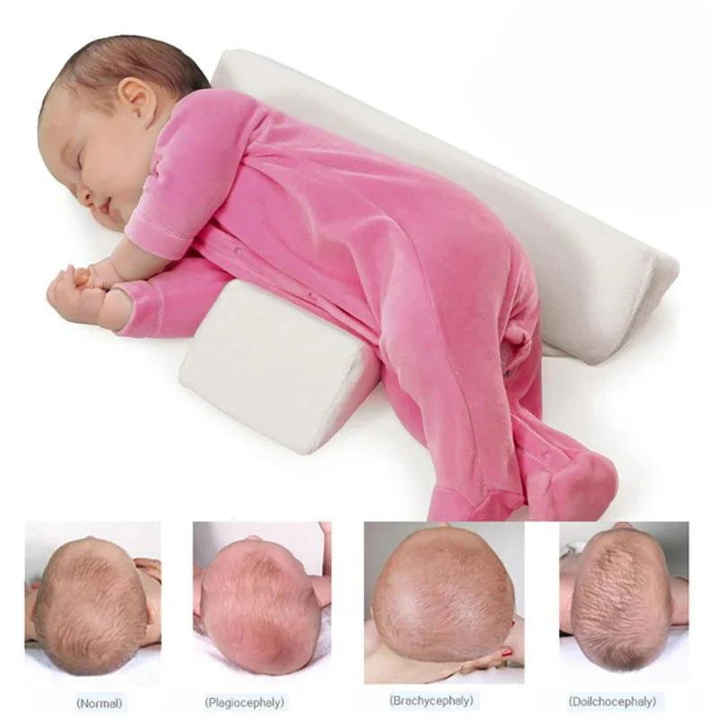 Ergonomic newborn baby sleep pillow with triangular design and removable pillowcase for comfortable, supported side sleeping