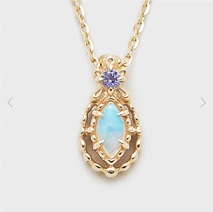 A captivating vintage-inspired necklace crafted with 14K gold-plated silver and adorned with mesmerizing Australian opal accents