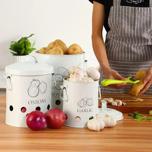 Breathable metal storage bins with handles for storing fresh produce like onions, potatoes and garlic in the kitchen.