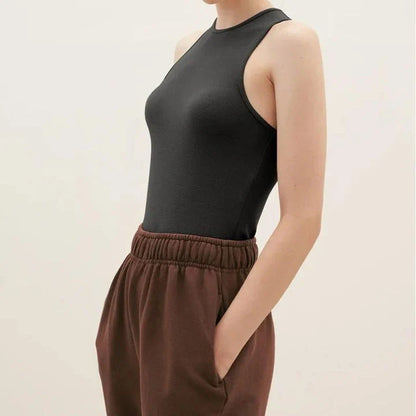 Stylish summer bodycon tank top for Kiwi women, featuring a comfortable and flattering design in a classic beige color.