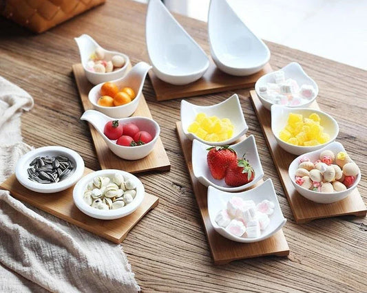 Stylish ceramic snack trays with natural wood pallet, perfect for serving nibbles and entertaining in Kiwi-style homes