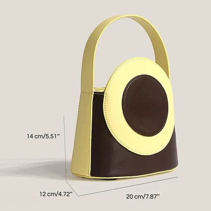 Stylish vegan leather colour block bucket bag with adjustable strap, perfect for modern Kiwi lifestyles