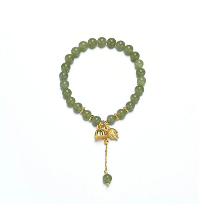 Handcrafted Hotian jade bracelet with a vintage-inspired floral design, a timeless Kiwi treasure