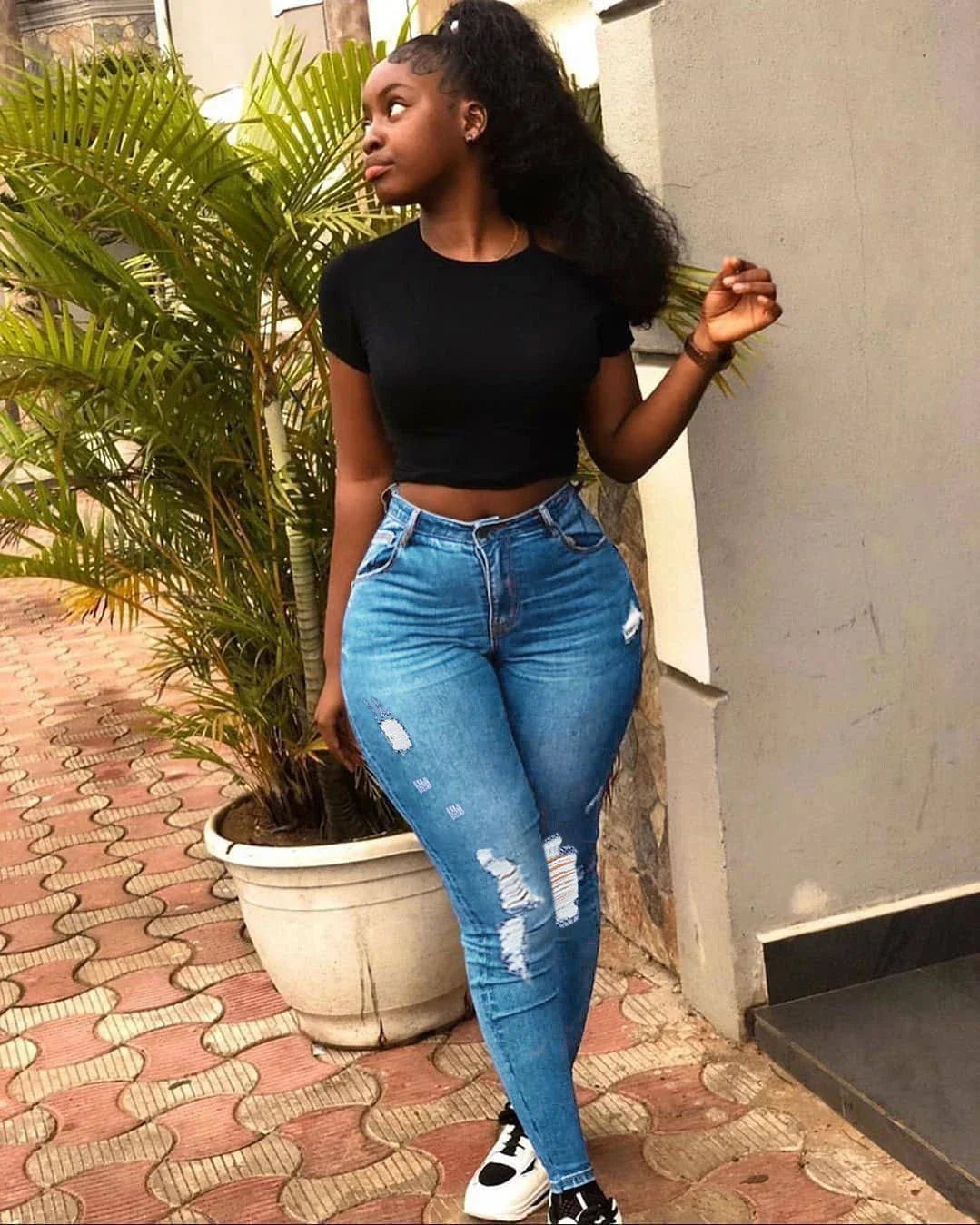 Stylish and versatile denim jeans with a fashionable distressed design, perfect for Kiwi students