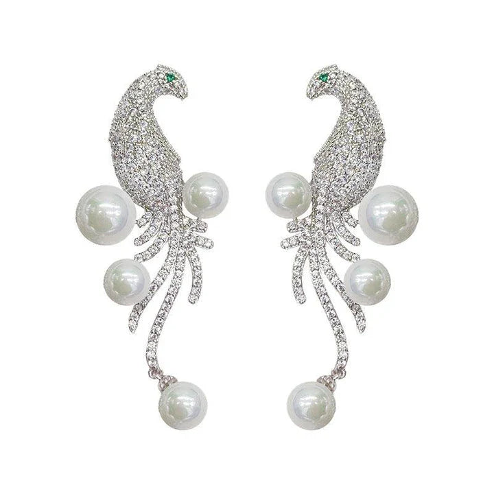 Elegant bird-themed pearl and tassel stud earrings in a versatile design