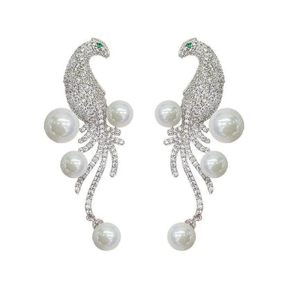 Elegant bird-themed pearl and tassel stud earrings in a versatile design