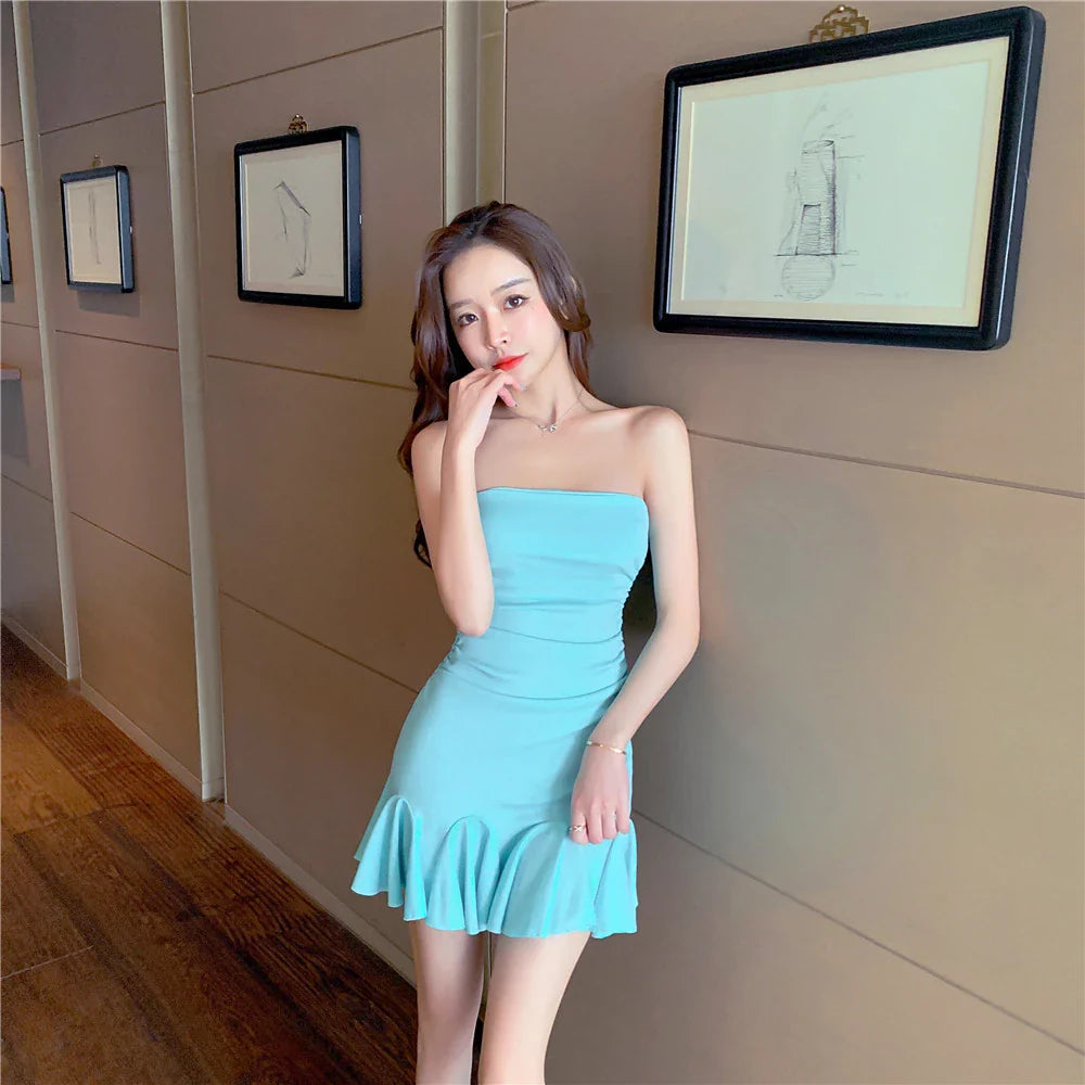 A stylish off-the-shoulder dress with ruffled hip detail, available in black and lake blue colors