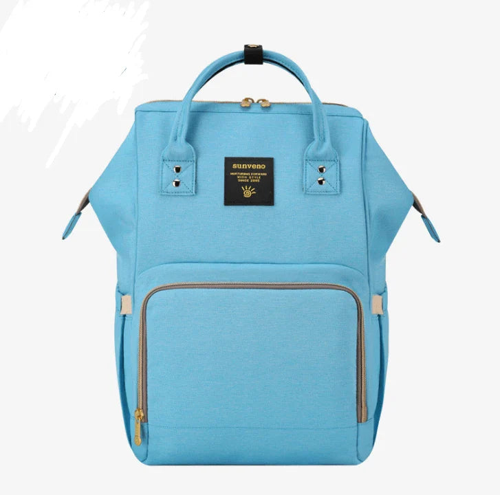 Stylish and practical mummy bag with reinforced handles, durable buckles, and separate bottling area for Kiwi mums