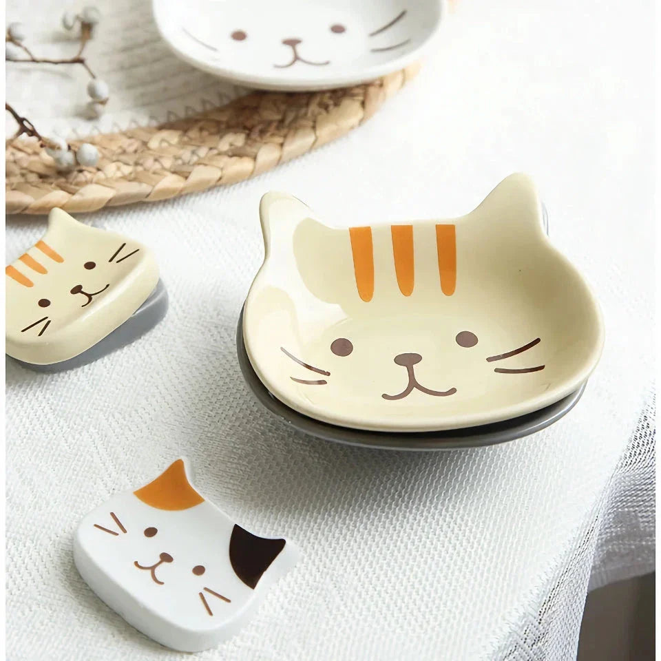 Charming Japanese-style ceramic condiment dish with a playful cat design, perfect for serving sauces, dips, and small snacks.