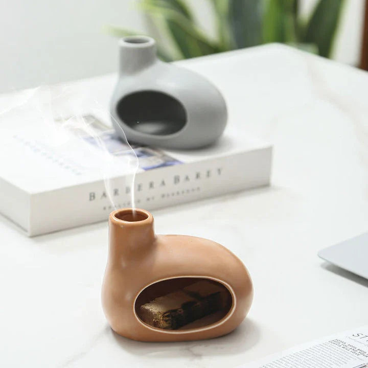 Elegant ceramic Palo Santo incense burner with modern, minimalist design in light brown, white, and gray color options